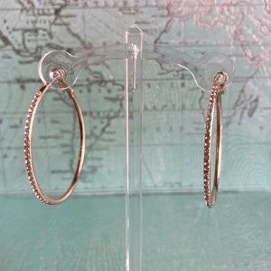Gold hoops with rhinestone embellishments